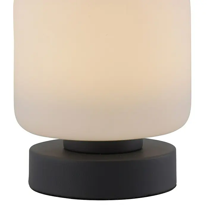 Just Light Lámpara de sobremesa LED Bota - 5 W, L x An x Al: 12 x 12 x 15,5 cm, Negro, Blanco cálido - Primer plano de una elegante lámpara de mesa con una pantalla cilíndrica de brillo suave y una base redonda de color antracita.