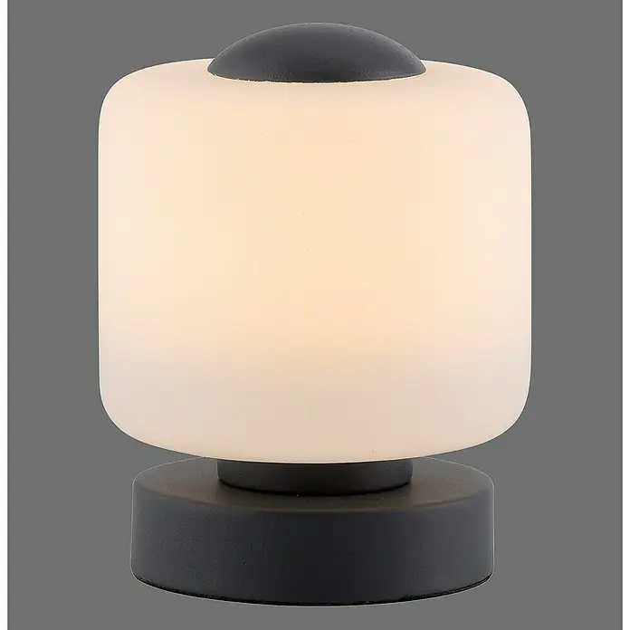 Just Light Lámpara de sobremesa LED Bota - 5 W, L x An x Al: 12 x 12 x 15,5 cm, Negro, Blanco cálido - Primer plano de una moderna lámpara de mesa cilíndrica con base y botón negros.