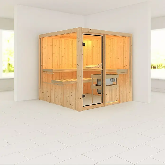 Karibu Elementsauna Rodin - Mit 9 kW Ofen mit integrierter Steuerung, Ohne Dachkranz, L x B x H: 196 x 196 x 192 cm - Innenaufnahme einer Holzsauna mit Glastür und Sitzbänken in einem hellen Raum. Die Sauna strahlt Wärme und Entspannung aus.