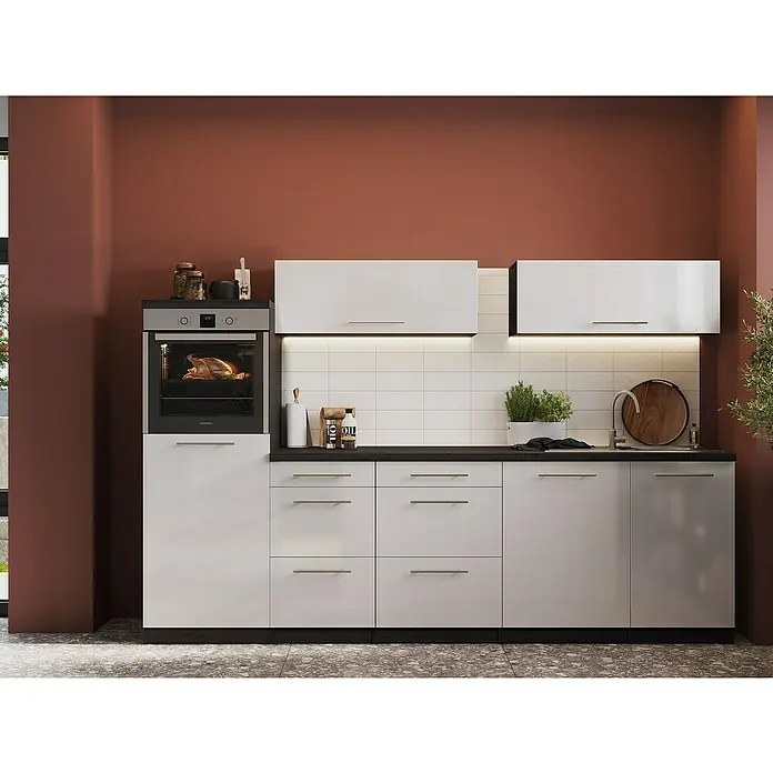 Respekta Premium Inselküche RP280IEWCBO - Breite: 280 cm, Weiß, Mit Elektrogeräten - Bild einer stilvollen Küche mit weißen Schränken, dunklen Arbeitsplatten und modernen Geräten, die ein elegantes Küchendesign zeigen.