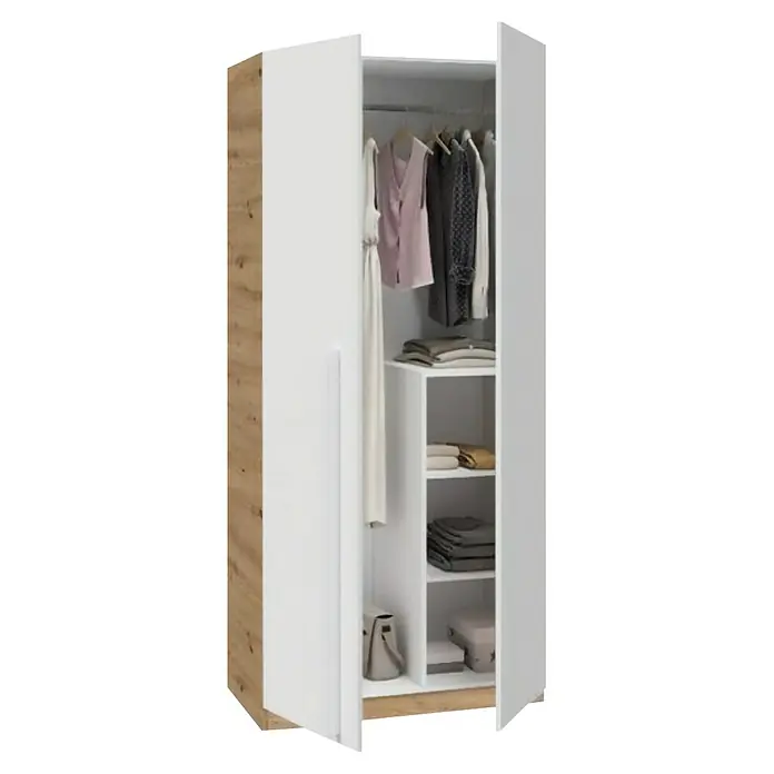 Armario para ropa y cama Noa - Roble Nodi/Blanco Artik - Un armario abierto que muestra ropa colgada en una barra y artículos plegados en estantes. El mueble tiene un acabado blanco y color madera.