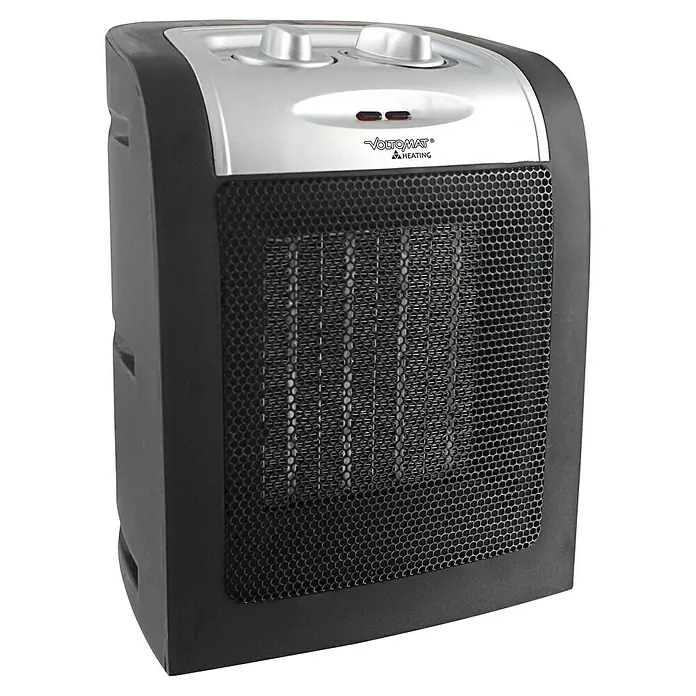 Voltomat HEATING Heizlüfter - 900 kW - 1.800 W, Schwarz, 12 x 17 x 22 cm - Ein elektrischer Heizlüfter von VOLTOMAT, ideal für die schnelle Wärmeversorgung. Mit Bedienelementen oben und einem schwarzen Schutzgitter.