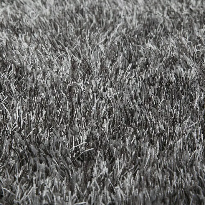 Kayoom Hochflorteppich DiamondGrau/Weiß, 170 x 120 cm, 100 % Polyester - Nahaufnahme eines grauen, zotteligen Teppichs. Dieser weiche, strukturierte Teppich verleiht jedem Raum Komfort und Stil.\n