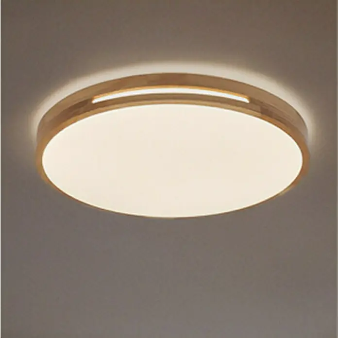 Osram Orbis LED-Deckenleuchte rund Woodburry - 16 W, Ø x H: 30 x 6,5 cm, Holzdekor, Warmweiß - Nahaufnahme einer runden LED-Deckenleuchte mit Holzrahmen, die ein warmes, einladendes Licht ausstrahlt.
