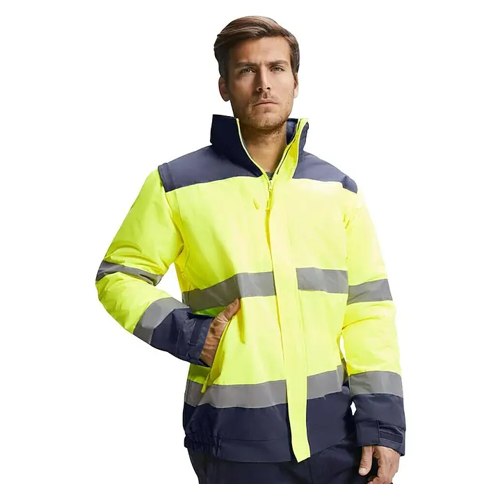 Chaqueta de alta visibilidad Epsylon - M, Amarillo flúor/Azul - Chaqueta amarilla de alta visibilidad con bandas reflectantes y detalles en azul oscuro, ideal para construcción y entornos laborales.