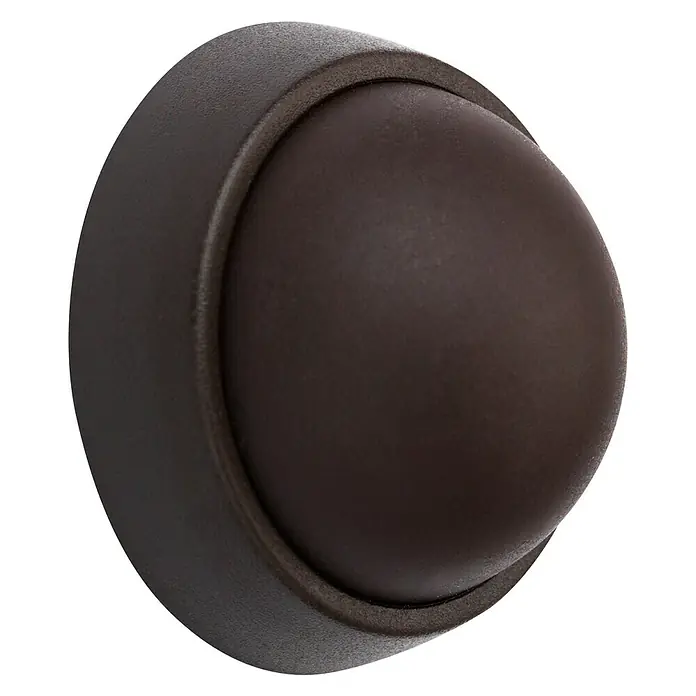 Inofix Tope de puerta 2450 - Plástico, Marrón - Primer plano de un tope de puerta marrón en forma de cúpula con un acabado texturizado, ideal para proteger las paredes.