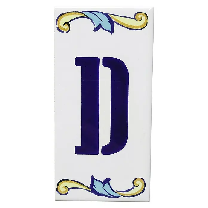 Pavimento cerámico Letra D - 7,5 x 15 cm, Blanco/Azul/Amarillo, Brillante - Baldosa de cerámica con la letra "D" en azul, adornada con elementos florales en amarillo y azul. Ideal para diseños de pared personalizados.