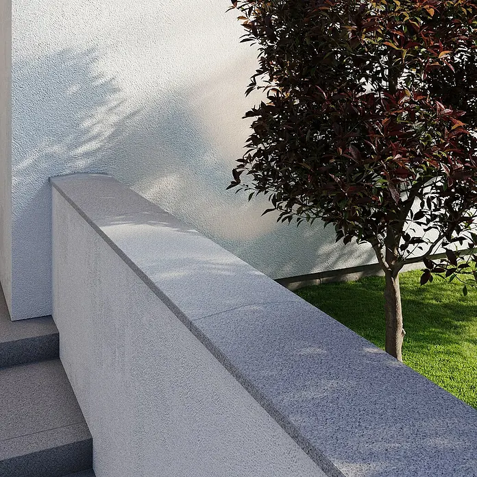 Mauerabdeckplatte G 603 - 100 x 29 x 2,5 cm, Grau, Granit - Nahaufnahme einer modernen Steintreppe mit grauer Steinmauer und einem Baum im Hintergrund, der Schatten auf die Wand wirft.