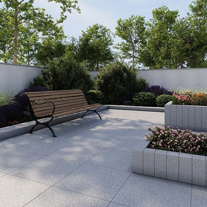 Terrassenplatte G 603 - 60 x 60 x 3 cm, Grau, Granit - Eine idyllische Gartenszene mit einer einladenden Holzbank und blühenden Blumenbeeten, die zum Verweilen im Freien einlädt.