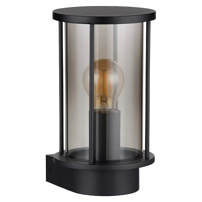 Globo Aplique exterior Gracey - 60 W, 14,3 x 14,3 x 25,2 cm, Antracita, IP54, Sin sensor - Primer plano de una lámpara de pared negra con una pantalla cilíndrica transparente y una bombilla Edison en su interior.