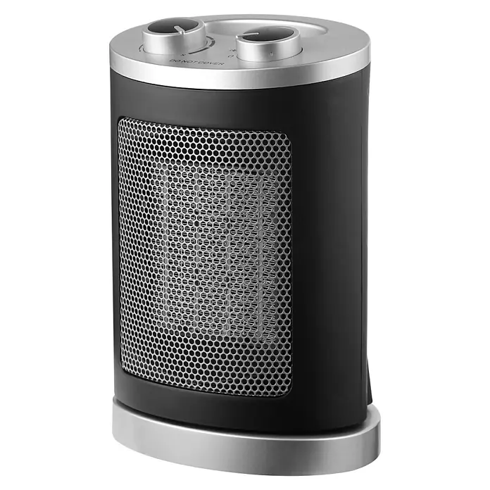 Voltomat HEATING Heizlüfter - 1.000 W - 1.500 W, Schwarz, 17 x 13 x 24,5 cm - Ein tragbarer, zylindrischer Heizlüfter in Schwarz und Silber mit einem runden Gitter und zwei Drehknöpfen zur Steuerung.