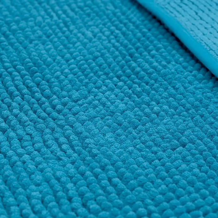 Camargue Badteppich Zottel - 50 x 80 cm, Türkis, 100% Polyester - Nahaufnahme eines türkisfarbenen Badteppichs mit Noppenstruktur. Die weiche Oberfläche lädt zum Barfußlaufen ein und sorgt für Komfort.