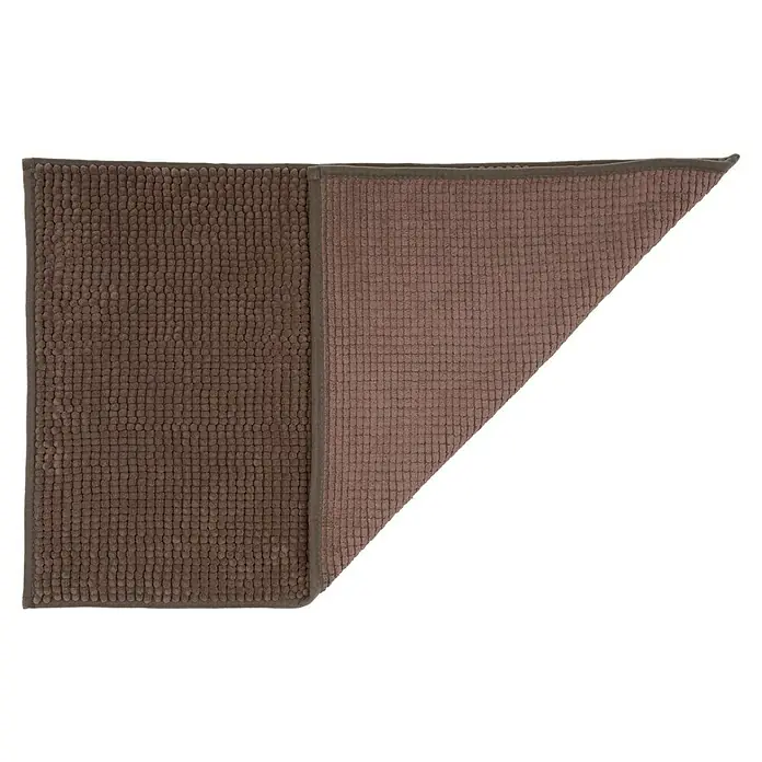Camargue Badteppich Zottel - 50 x 80 cm, Braun, 100% Polyester - Eine Nahaufnahme einer braunen Badematte mit Noppenstruktur, die teilweise umgeschlagen ist und einen helleren Farbton auf der Rückseite zeigt.