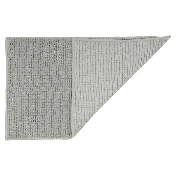 Camargue Badteppich Zottel - 50 x 80 cm, Manhattan, 100% Polyester - Graue Badematte, teilweise umgeklappt, zeigt unterschiedliche Texturen, die Saugfähigkeit und Komfort vereinen.
