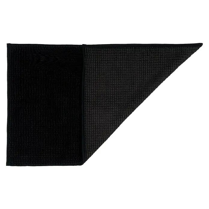 Camargue Badteppich Zottel - 50 x 80 cm, Schwarz, 100% Polyester - Schwarze Badematte aus saugfähigem Material, zur Hälfte gefaltet, um die Textur zu zeigen. Ideal für Badezimmer.