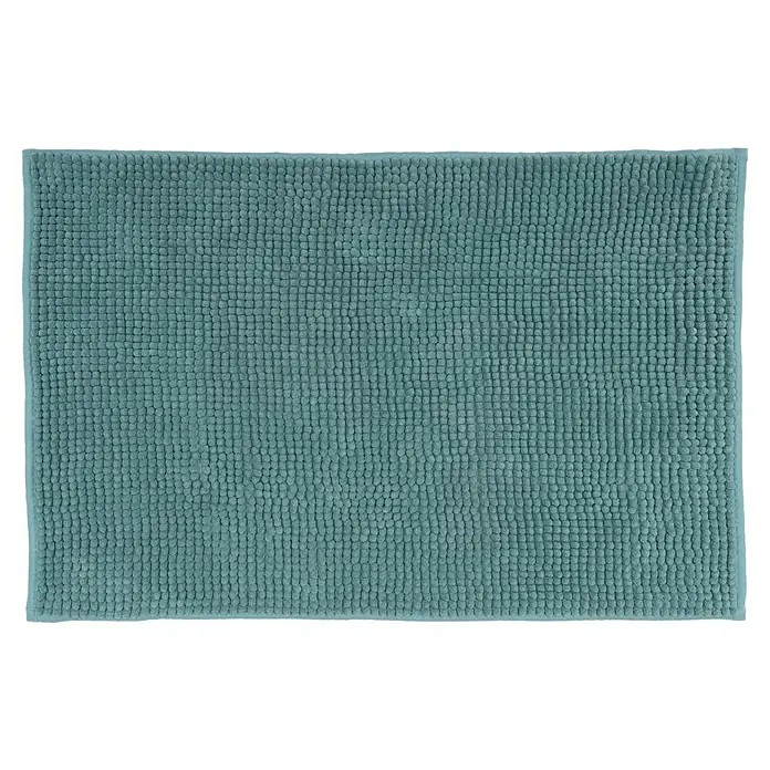 Camargue Badteppich Zottel - 50 x 80 cm, Petrol, 100% Polyester - Nahaufnahme einer rechteckigen, zyanblauen Badematte mit texturierten Noppen, die eine weiche und saugfähige Oberfläche für Badezimmer bietet.