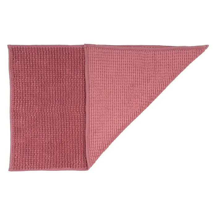 Camargue Badteppich Zottel - 50 x 80 cm, Brombeere, 100% Polyester - Nahaufnahme einer gefalteten, rosafarbenen Badematte mit strukturierter Oberfläche, ideal für Badezimmerböden, die Komfort und Stil bieten.