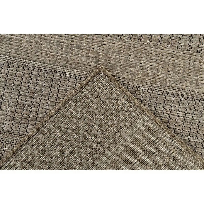 Outdoor-Teppich Costa 303 - Nature, 230 x 160 cm - Nahaufnahme eines Teppichs mit gefalteter Ecke, der die Textur und Verarbeitung des Produkts zeigt.