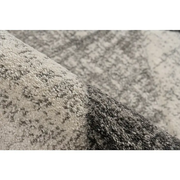 Kurzflorteppich Trendy CarvingSilber, 150 x 80 cm, 100 % Polypropylen - Nahaufnahme eines grauen Teppichs mit Textur.