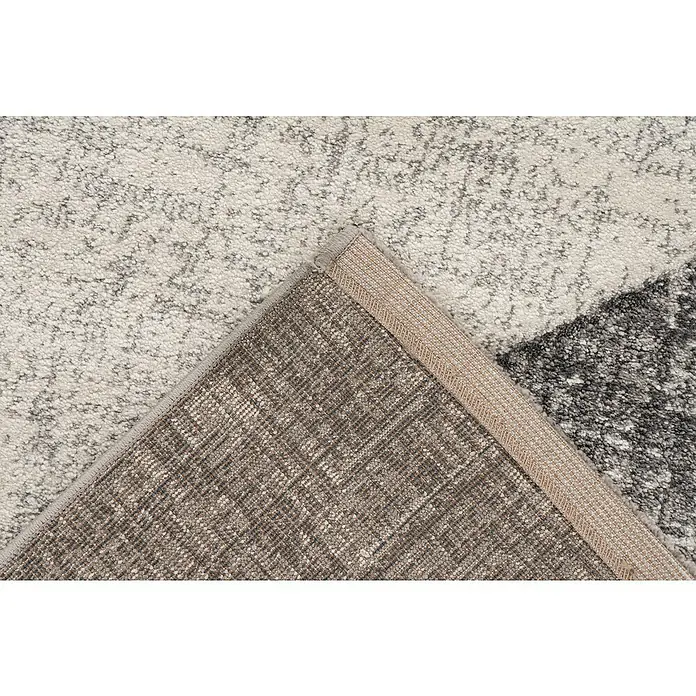 Kurzflorteppich Trendy CarvingSilber, 150 x 80 cm, 100 % Polypropylen - Nahaufnahme eines strukturierten Teppichs mit beiger Bordüre, der die detailreiche Verarbeitung und das Muster hervorhebt.