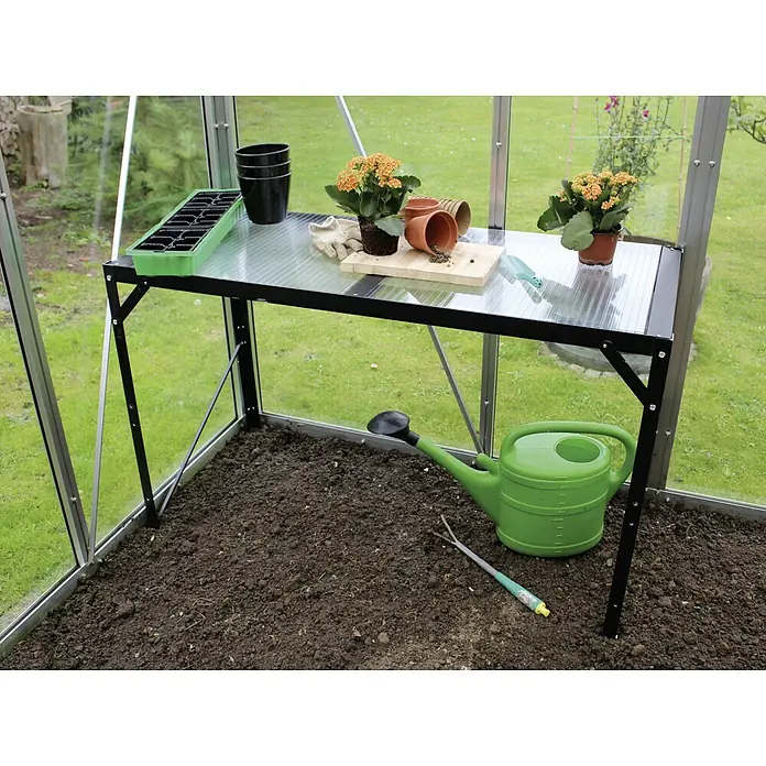 Vitavia Anzuchttisch II - 54 x 121 x 76 cm, Schwarz - Gewächshaus mit einem Tisch, auf dem Töpfe, Erde und eine Gießkanne stehen, ideal für die Gartenarbeit.