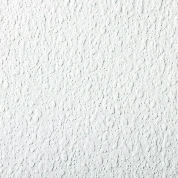 Rasch Vliestapete Feel Good - Weiß, Uni, 10,05 x 0,53 m, Grobe Struktur - Nahaufnahme einer weißen, strukturierten Oberfläche mit unregelmäßigen, erhabenen Punkten. Ideal als neutraler, abstrakter Hintergrund.