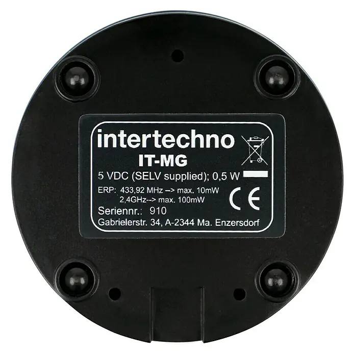 Intertechno Steuerzentrale Smart Home IT-MG - Reichweite ca.: 30 m, Ø x H: 80 x 30 mm, Mastergate App - Das Intertechno IT-MG Gerät, ein elektronisches Bauteil mit technischen Spezifikationen und CE-Kennzeichnung, präsentiert auf schwarzem Untergrund.