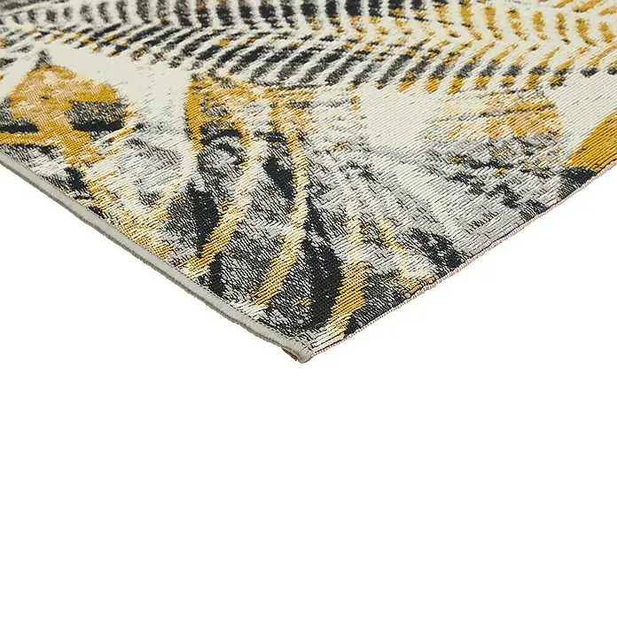 Outdoor-Teppich Portland - Grau/Gelb, 235 x 160 cm, 75 % Polypropylen, 25 % Polyester - Detailaufnahme eines gemusterten Teppichs in Weiß, Gelb und Schwarz, der eine interessante Textur und ein modernes Design aufweist.