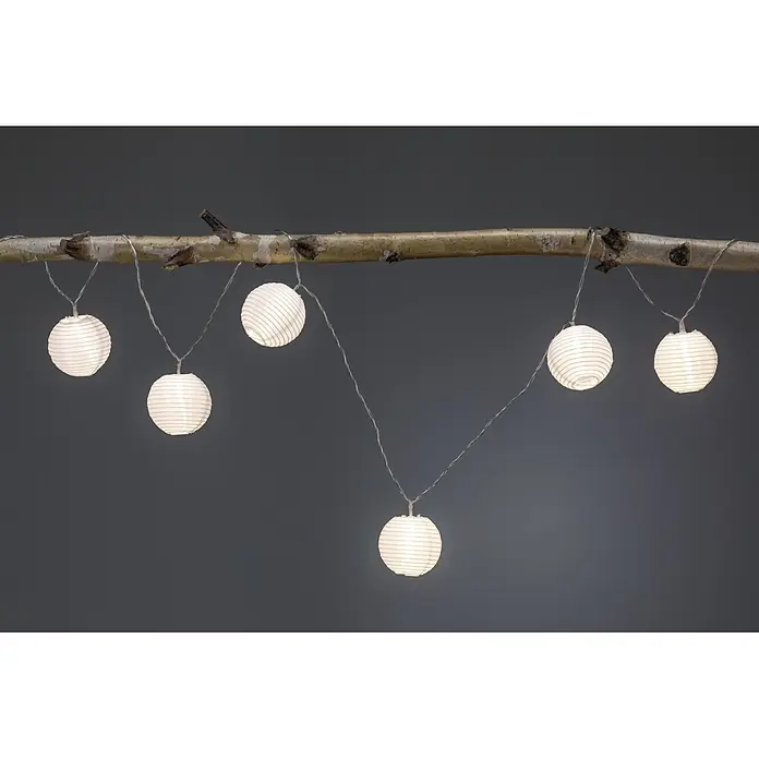 Paulmann Guirnalda luminosa LED Lampion - 3,6 m, Para exterior - Guirnalda de luces decorativa con farolillos de papel colgando de una rama, creando un ambiente cálido y acogedor.