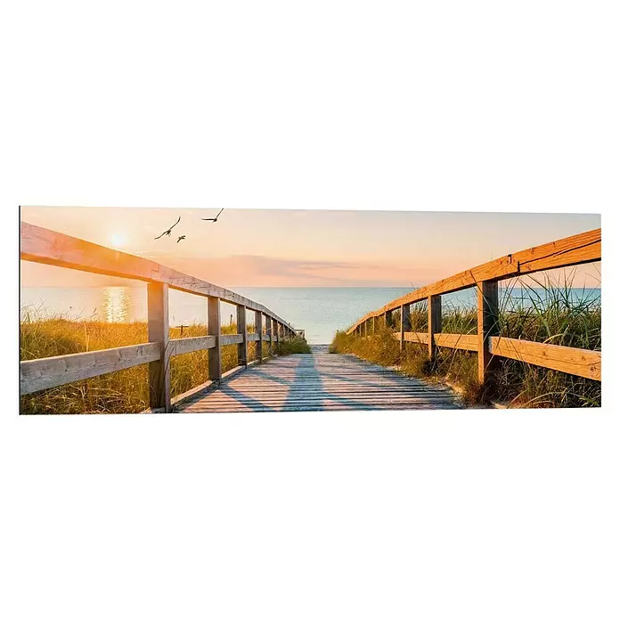 Reinders Decopanel - Beach Boardwalk, B x H: 90 x 30 cm - Holzsteg führt zum Meer bei Sonnenuntergang, von Holzgeländern und hohem Gras gesäumt.