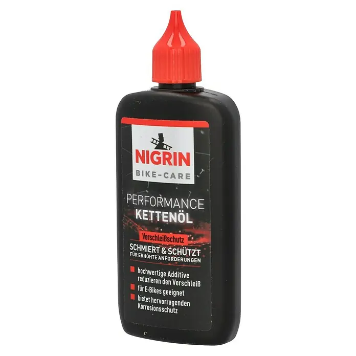 Nigrin Kettenöl E-Bike - 100 ml - Abbildung einer Flasche Nigrin Bike-Care Kettenöl Performance mit rotem Verschluss.