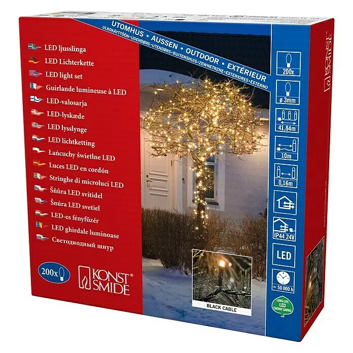 Konstsmide LED-Lichterkette Micro LED - Außen, Lichtfarbe: Bernstein, Anzahl Leuchtmittel: 200 Stk., Netzbetrieben - Verpackung von Konstsmide LED Lichterkette mit 200 warmweißen Mikro-LEDs an schwarzem Kabel, einen Baum im Freien schmückend.