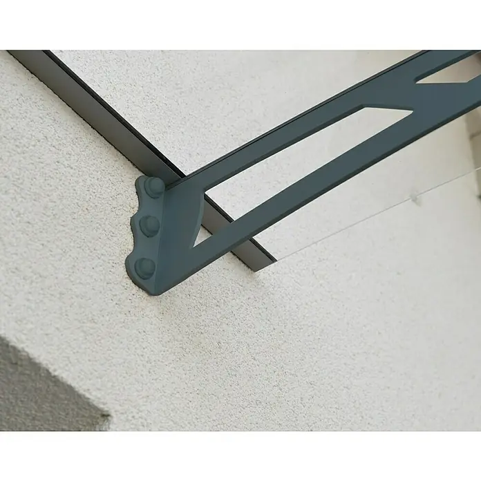 Palram – Canopia Pultvordach Aquila - 150,5 x 91,5 x 17,5 cm, Anthrazitgrau, Farbe Dach: Klar - Nahaufnahme einer modernen grauen Türvordachkonstruktion an einer weißen Wand, die Schutz und Design vereint.