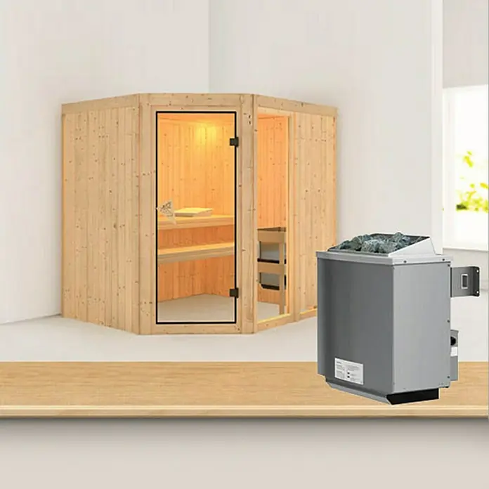 Karibu Elementsauna Fiona - Mit 9 kW Ofen mit integrierter Steuerung, Ohne Dachkranz, L x B x H: 196 x 170 x 192 cm - Diese Aufnahme zeigt eine Ecksauna aus hellem Holz mit Glastür und einem daneben stehenden Saunaofen mit Lavasteinen.