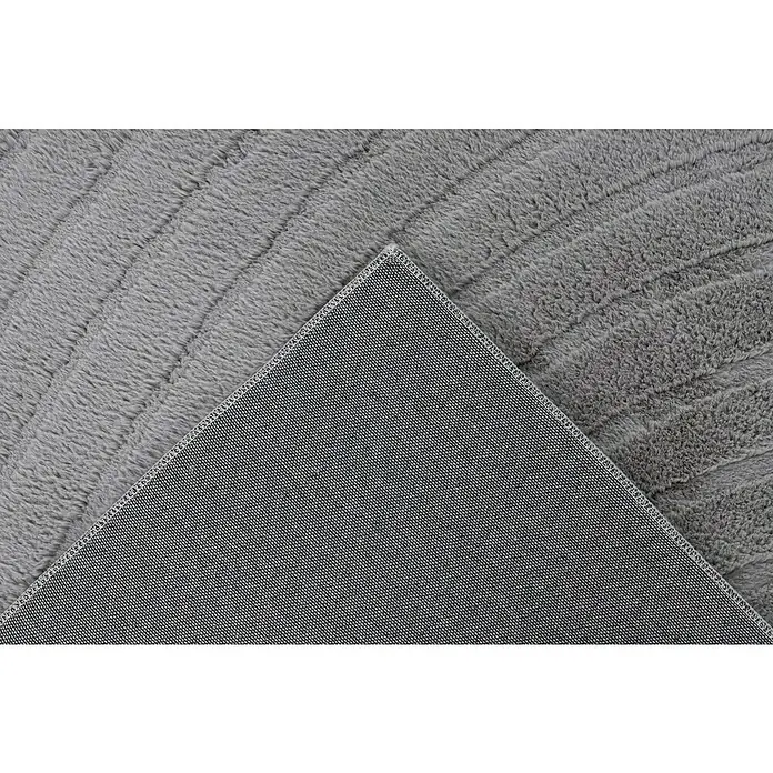 Fellteppich Zen - Silber, 170 x 120 cm, 100 % Polyester - Nahaufnahme eines grauen Teppichs, der die Textur und die Rückseite des Teppichs zeigt.