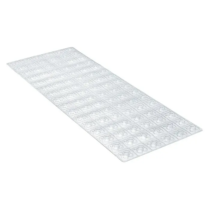 Tatay Alfombra antideslizante para ducha BCN - 36 x 96 cm, PVC, Translúcido - La imagen muestra una alfombra de baño transparente con un diseño floral, diseñada para proporcionar seguridad y resistencia al deslizamiento en la bañera.