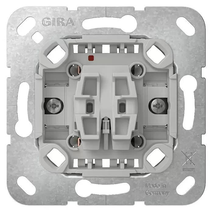 Gira Taster-Einsatz 315100 - 10 A - GIRA Elektro-Schaltereinsatz, Rückansicht, mit hellgrauem Kunststoffgehäuse, Metallmontageplatte und sichtbaren Kupferkontakten.