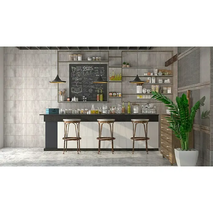 Bariperfil Perfil de acabado angular Betton Hell - 2,6 m x 3 cm - Interior con una barra, tres taburetes de bar, estanterías y una pizarra con letras de tiza, creando un ambiente elegante y acogedor.