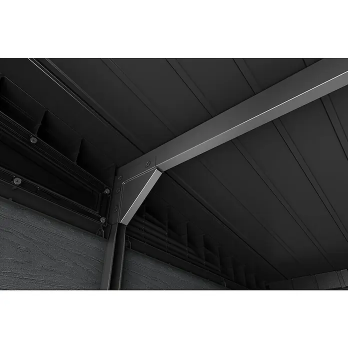 Keter Gerätehaus Signature Storm Grey 11x7 - Außenmaß inkl. Dachüberstand (B x T): 342 x 218 cm, Kunststoff, Stormgrey - Detailaufnahme einer schwarzen Gartenhauskonstruktion mit Metallrahmen und Schrauben, die Stabilität und modernes Design vereinen.