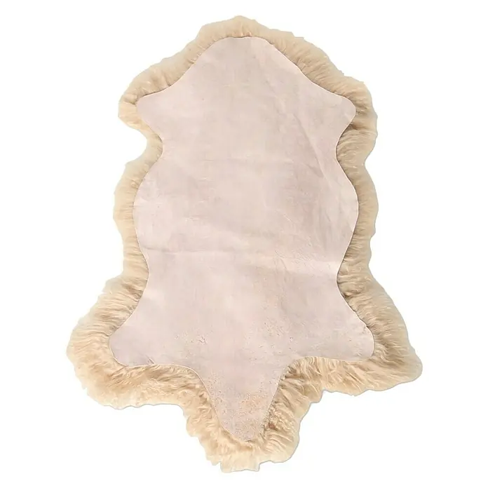 Esbeco Schaffell Tibet - Beige, 100 x 70 cm - Ein weicher, beiger Schaffellteppich, der Wärme und Komfort in jeden Raum bringt. Perfekt als dekoratives Element oder zum Einkuscheln.