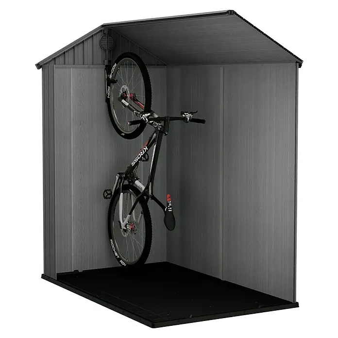 Keter Gerätehaus Darwin 4x6 - Außenmaß inkl. Dachüberstand (B x T): 125,8 x 184,5 cm, Kunststoff, Grün - Hier ist ein Fahrrad in einem grauen Gartenhaus abgebildet. Das Haus ist mit einer dunklen Gummimatte versehen.