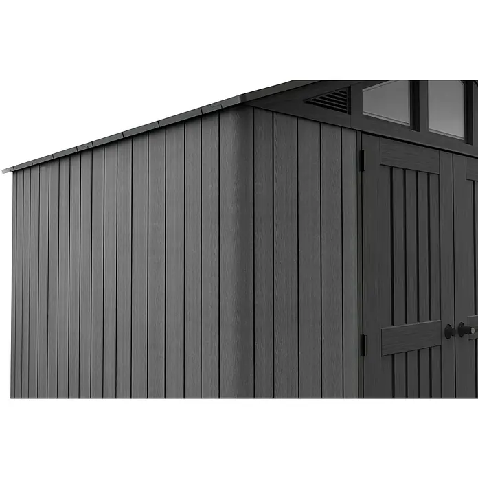 Keter Gerätehaus Stronghold 10x8 - Außenmaß inkl. Dachüberstand (B x T): 304 x 243 cm, Kunststoff, Grau - Detailansicht eines grauen Gartenhauses mit senkrechter Holzverkleidung, Türen und Dachfenstern, das Funktionalität und Ästhetik vereint.