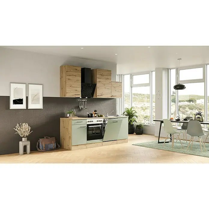Flex-Well Cara Küchenzeile - Breite: 220 cm, Höhe: 234 cm, Schilfgrün Antifingerprint / Artisan Eiche, Mit Elektrogeräten, Edelstahlspüle - Helle Küche mit Holzschränken und einer schwarzen Dunstabzugshaube, hellgrüne Unterschränke, Geschirrspüler ist geöffnet.