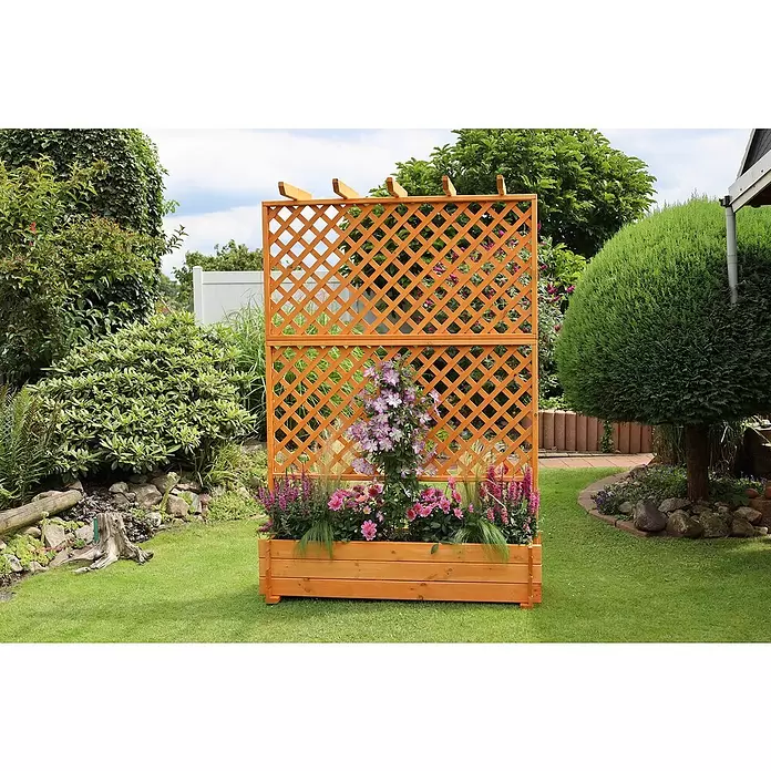 Promadino Pflanzkasten mit Pergola - Außenmaß (L x B x H): 200 x 64,5 x 140 cm, Holz, Honigbraun - Hölzernes Gartenspalier mit integriertem Pflanzkasten, gefüllt mit blühenden Blumen, in einem Garten.
