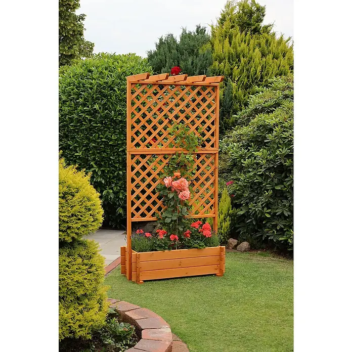 Promadino Pflanzkasten mit Pergola - Außenmaß (L x B x H): 200 x 64,5 x 102 cm, Holz, Honigbraun - Ein hölzernes Rosenbeet mit Rankgitter, das eine idyllische Gartenecke mit bunten Rosen und üppigem Grün schmückt.