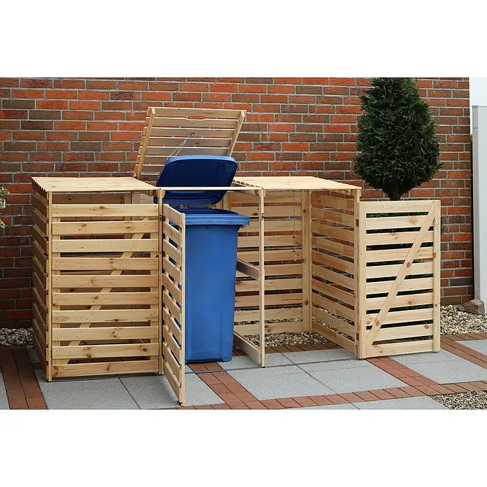Promadino Mülltonnenbox Vario V -  - Ein Holzzaun umgibt einen blauen Mülleimer und bietet eine attraktive und praktische Lösung für die Müllentsorgung im Außenbereich.