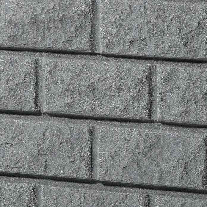 Garantia Exklusive Line Regenspeicher Rocky - 400 l, Darkgranite - Nahaufnahme einer grauen Backsteinmauer mit einer rauen Textur, die die Tiefe und das Detail des Baumaterials hervorhebt.