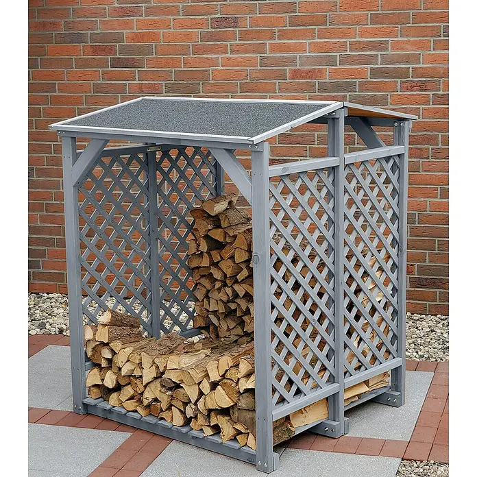 Promadino Kaminholzregal - 120 x 118 x 148 cm, Holz, Grau - Holzstapel mit grauem Holzregal vor einer Backsteinmauer.