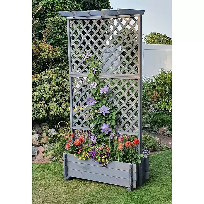 Promadino Pflanzkasten mit Pergola - Außenmaß (L x B x H): 200 x 64,5 x 102 cm, Holz, Grau - Graues Holz-Rankgitter mit Blumenkasten, gefüllt mit bunten Blumen und Kletterpflanzen im Garten.