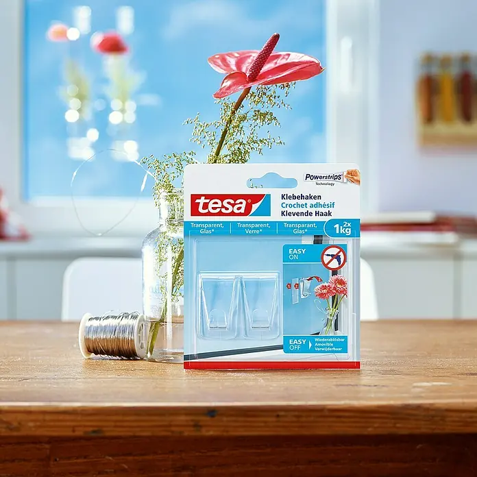 Tesa Klebehaken - Geeignet für: Glas, Belastbarkeit: 1 kg, 2 Stk., Transparent - Abgebildet sind Tesa Klebehaken für Glasflächen, transparent und wiederablösbar, ideal für leichte Gegenstände bis 1 kg.